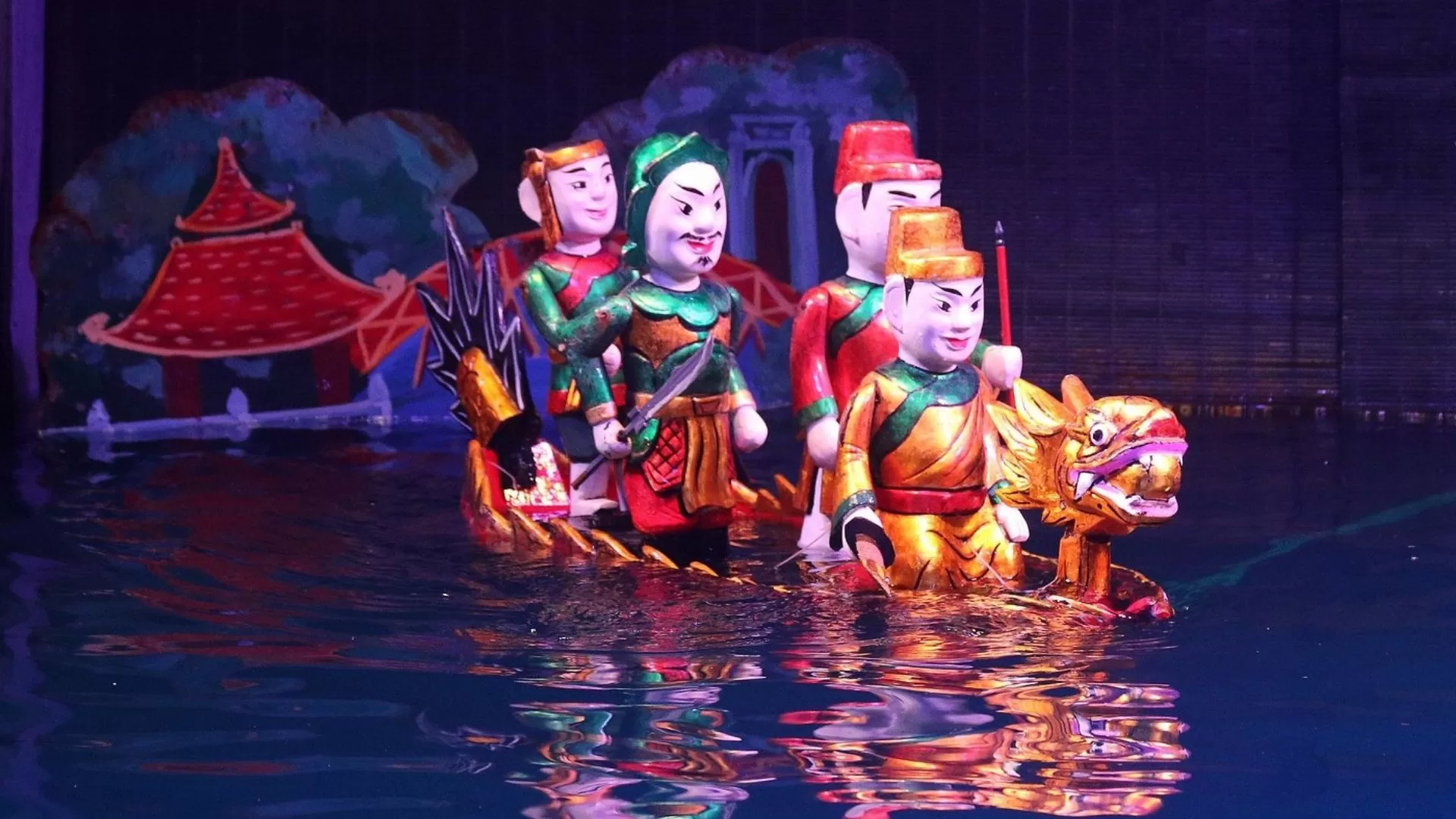 Water puppets performing a dragon boat scene